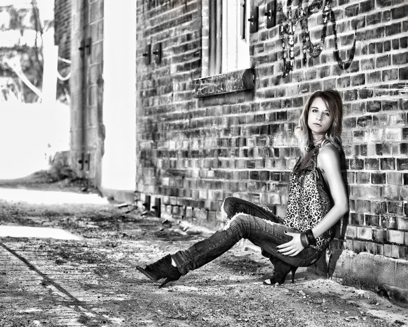 Woman Sitting on Ground — Black, Dramatic, Photograph