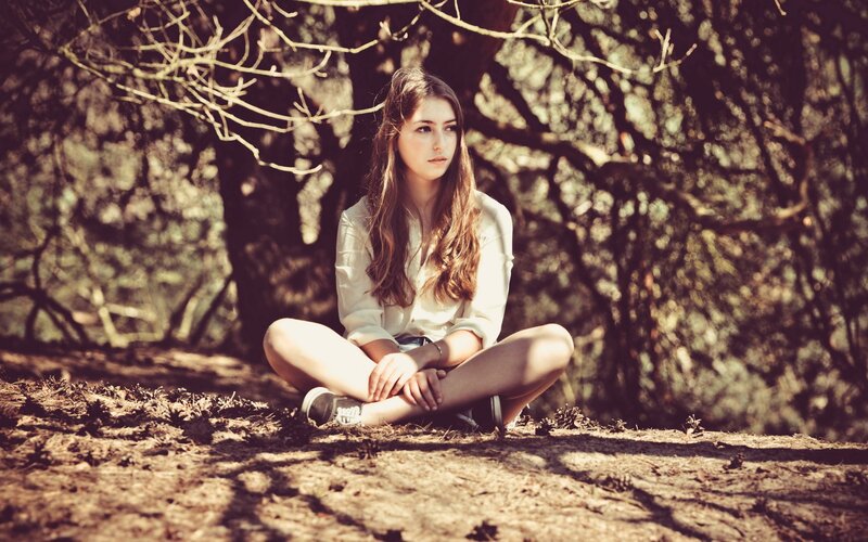 Woman Sitting on Ground — Brown, Contemplative