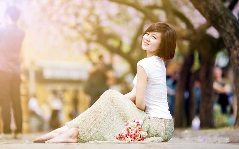 Woman Sitting on Ground — White, Serene
