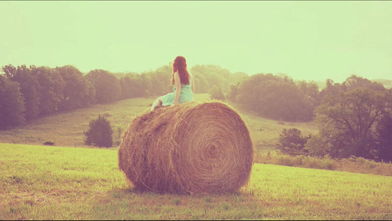 Woman Sitting on Hay Bale — Green