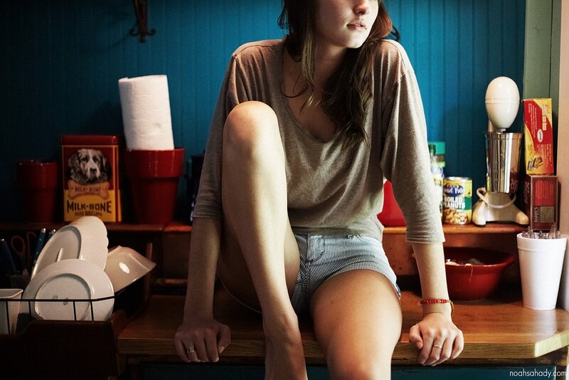woman sitting on kitchen counter