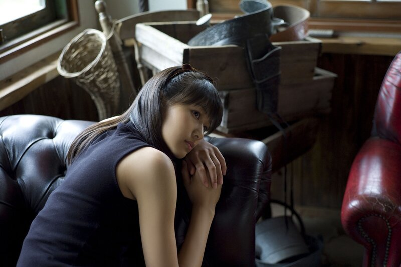 woman sitting on leather couch