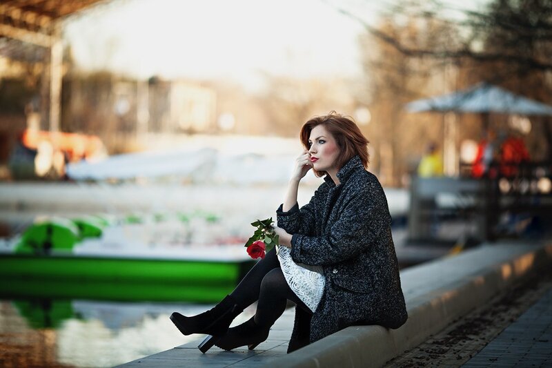 Woman Sitting on Ledge — Black, Contemplative, Autumn