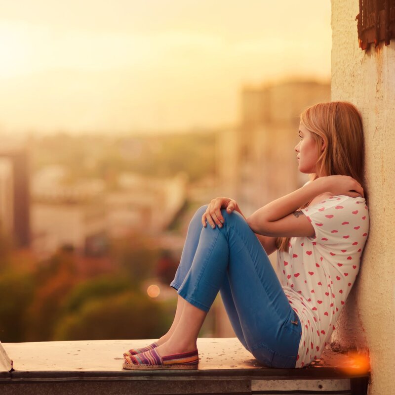 Woman Sitting on Ledge — Blue, Contemplative