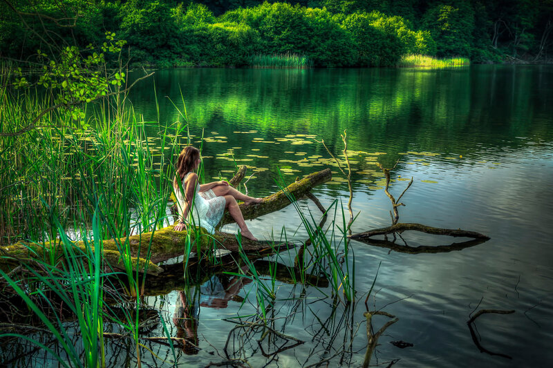 Woman Sitting on Log — Green, Serene