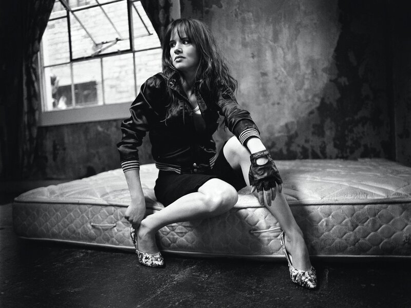 Woman Sitting on Mattress