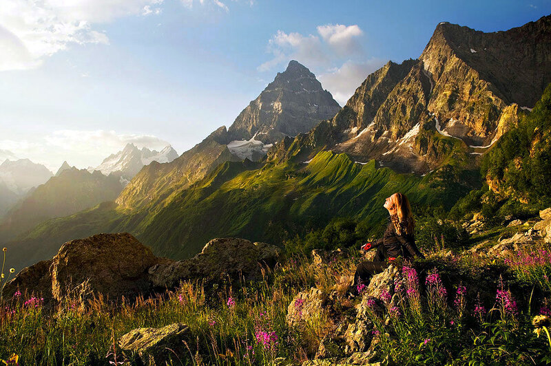 Woman Sitting on Mountain