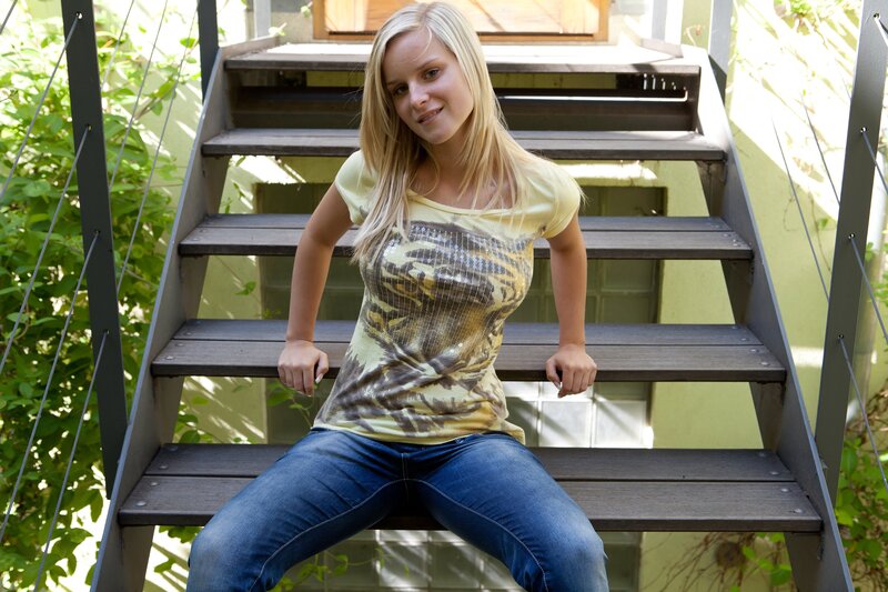woman sitting on outdoor stairs