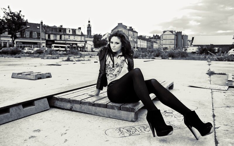 Woman Sitting on Pallet
