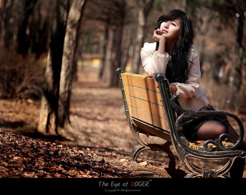 woman sitting on park bench