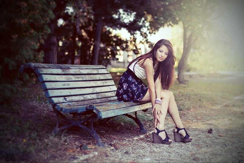 woman sitting on park bench