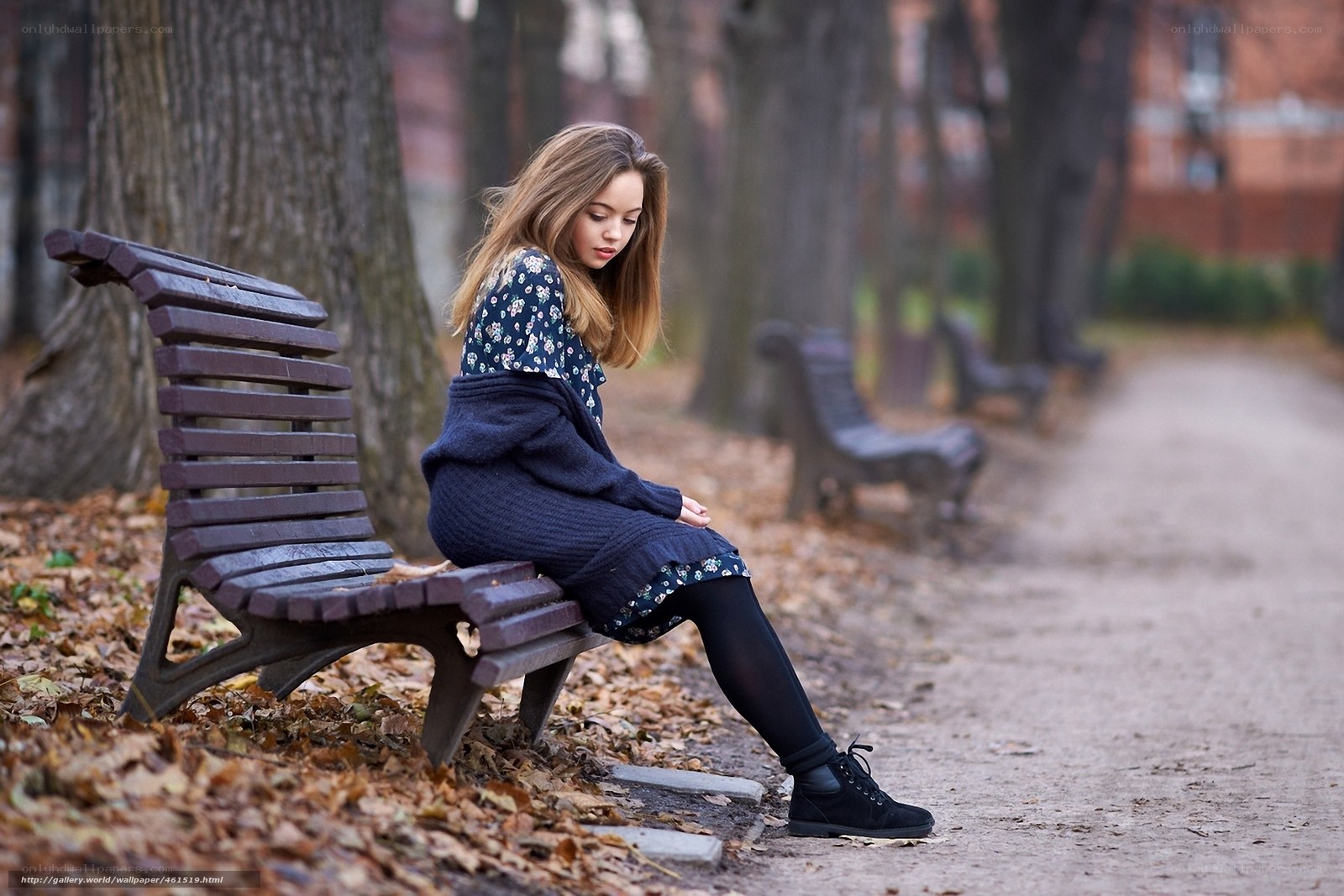 woman sitting on park bench