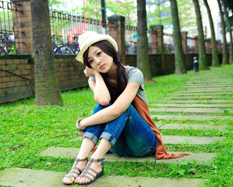 Woman sitting on park steps