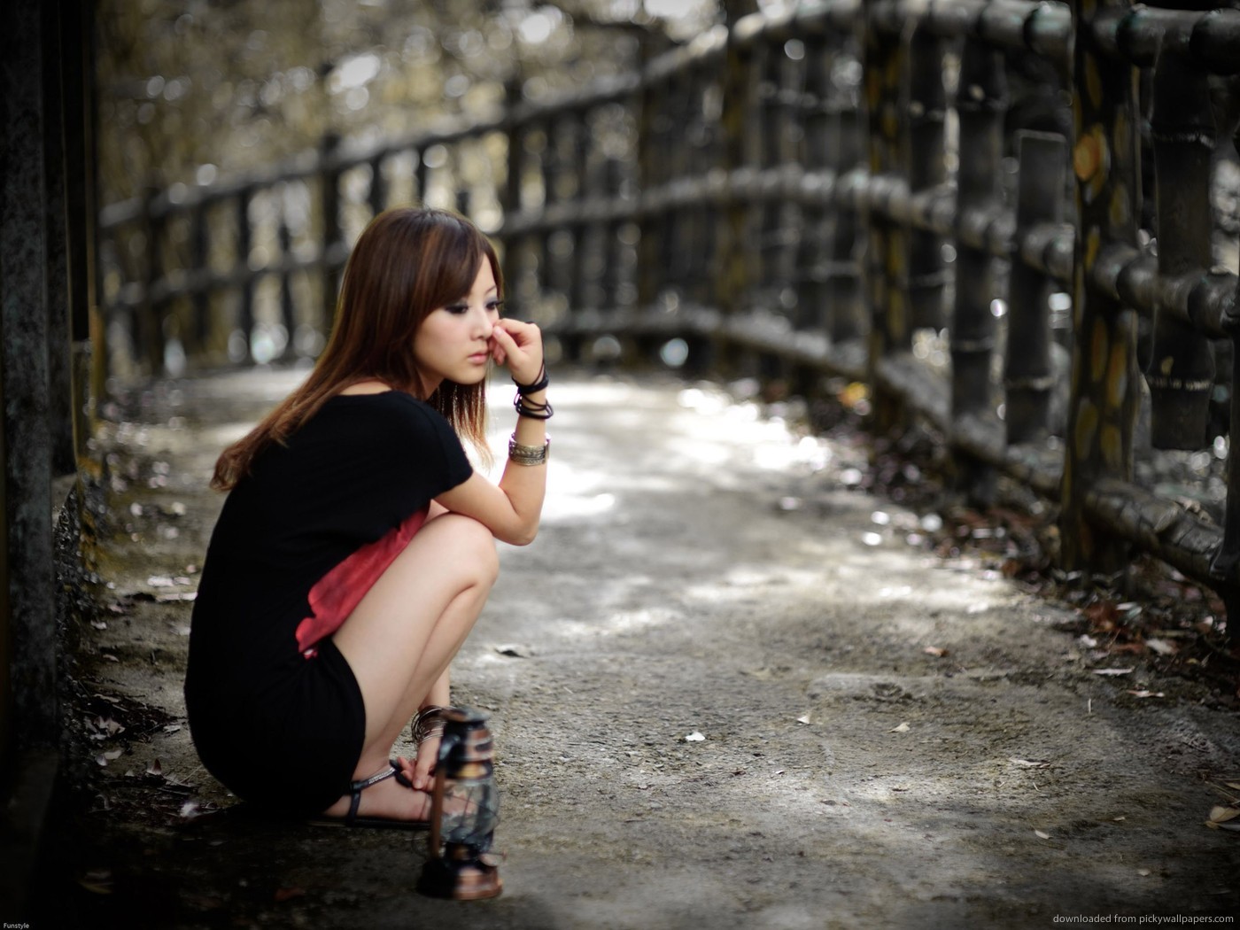woman sitting on path