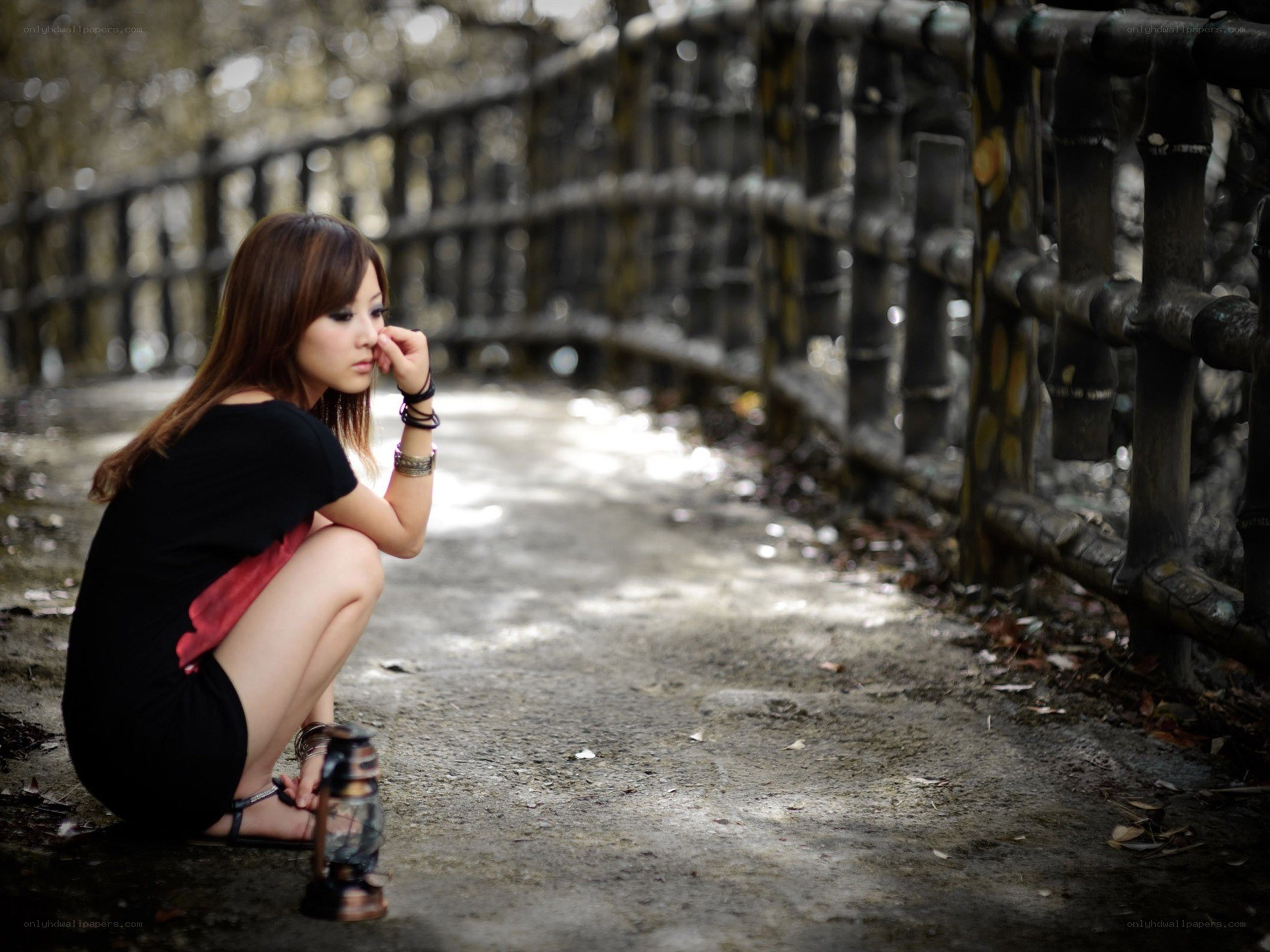 woman sitting on path
