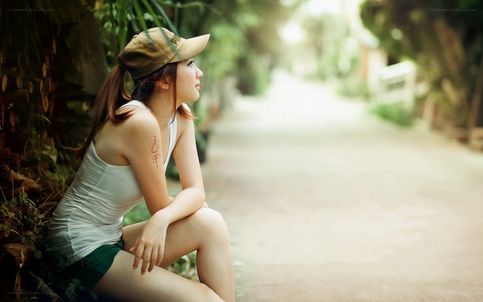 woman sitting on path