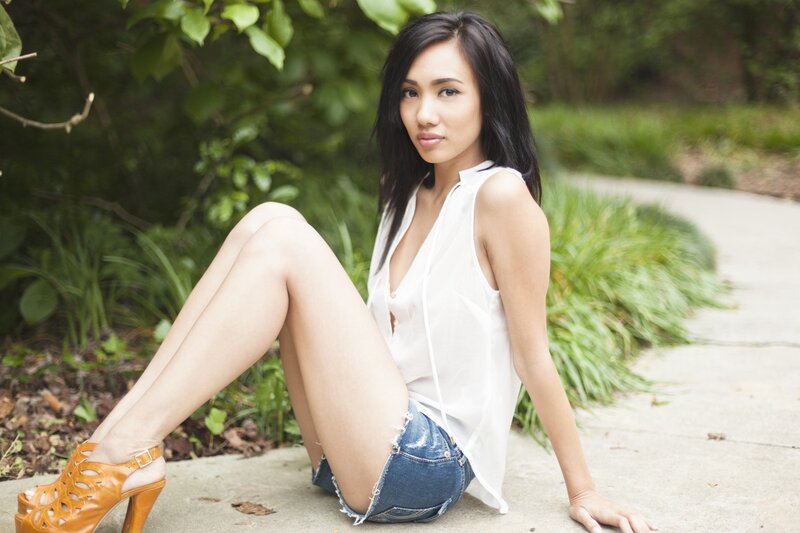 woman sitting on path in garden