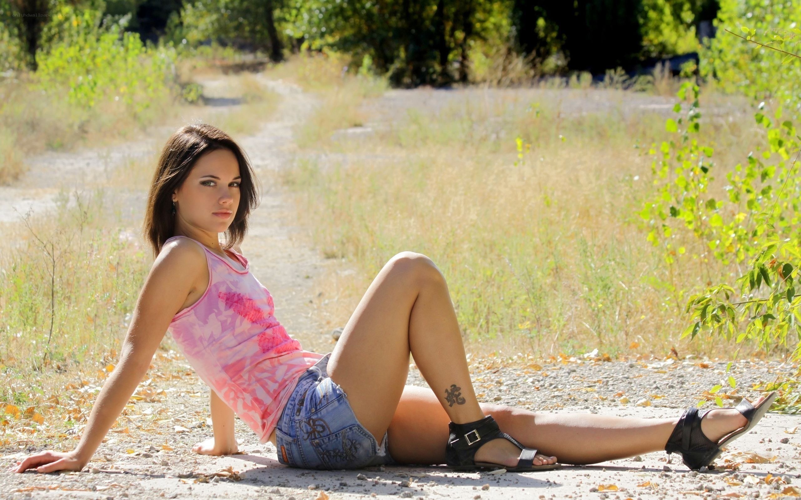 woman sitting on path