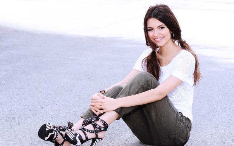 woman sitting on pavement