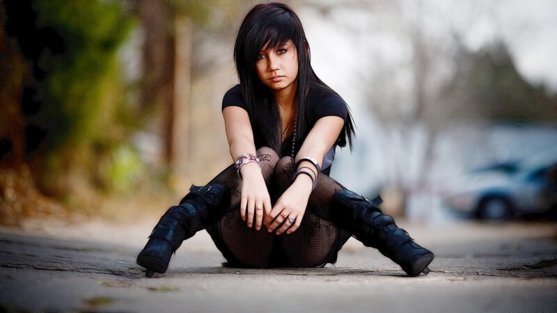 Woman Sitting on Pavement — Black, Somber, Afternoon