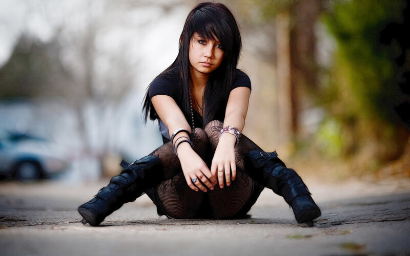 Woman Sitting on Pavement — Black