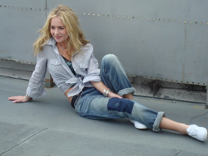 Woman Sitting on Pavement — Blue