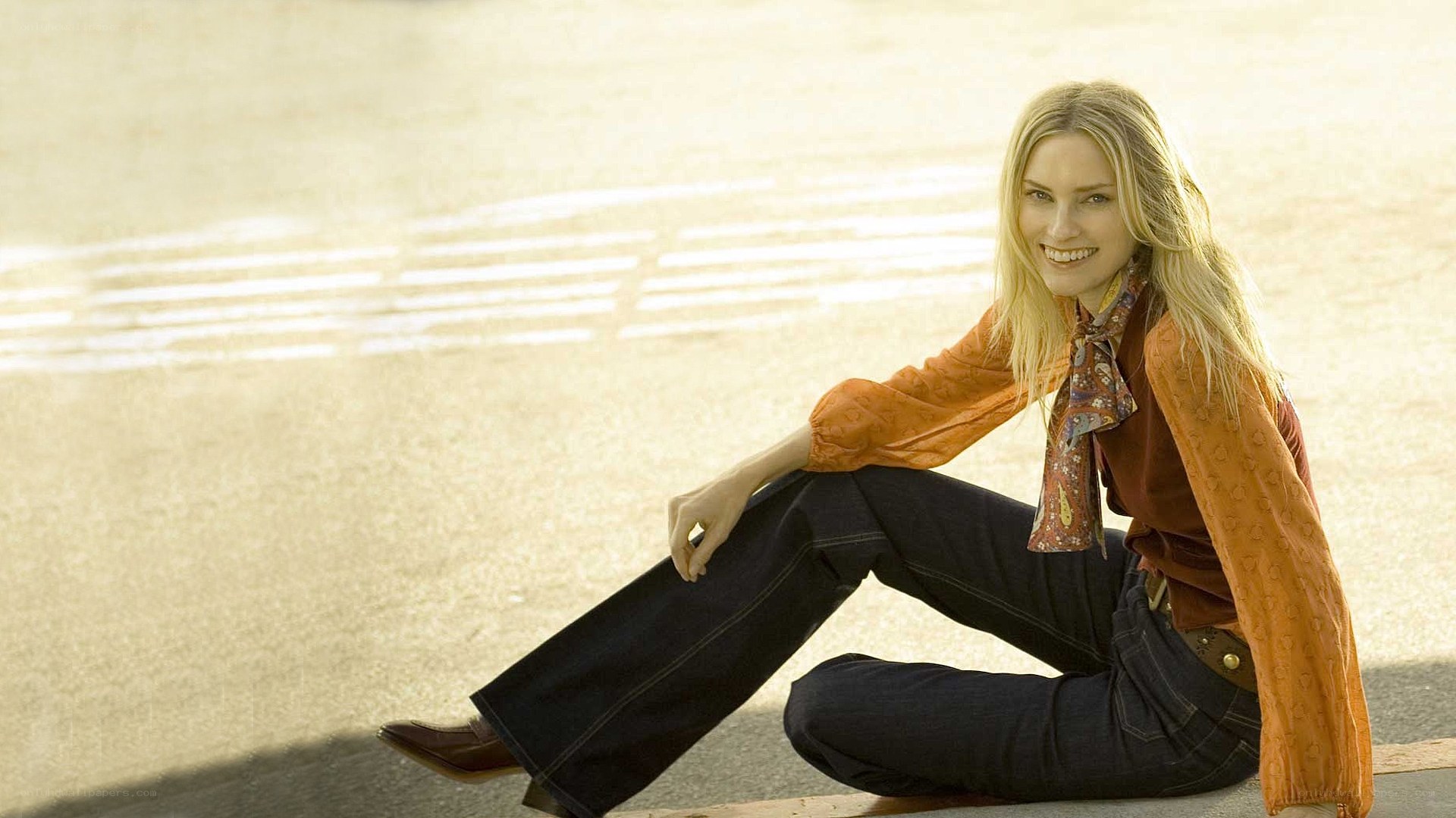 woman sitting on pavement