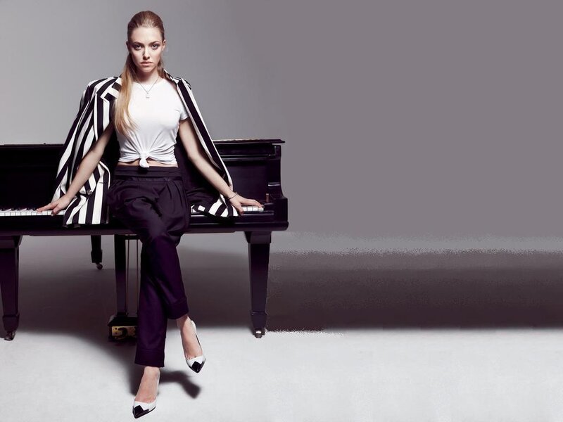 Woman Sitting on Piano — Black, Confident
