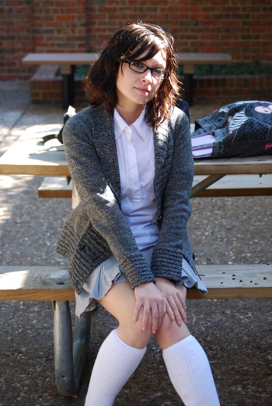 woman sitting on picnic bench