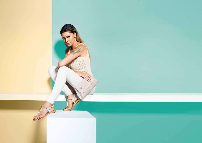 Woman Sitting on Platform — Teal