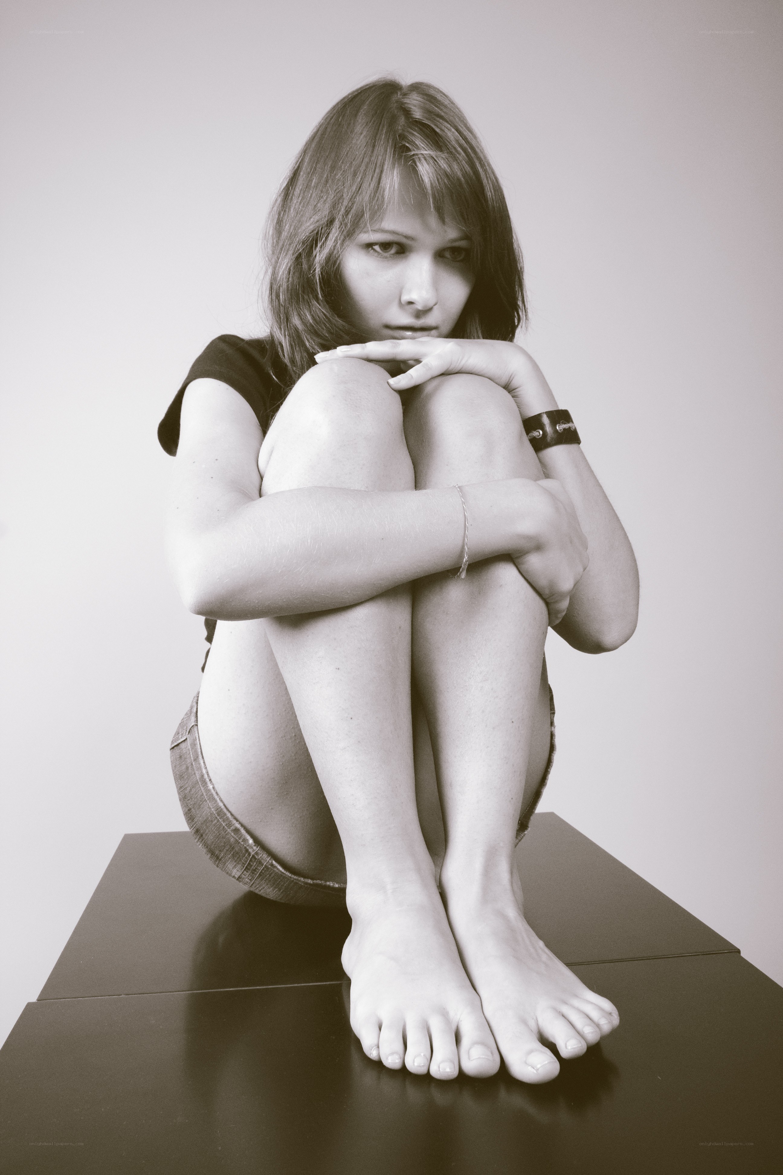 woman sitting on platform