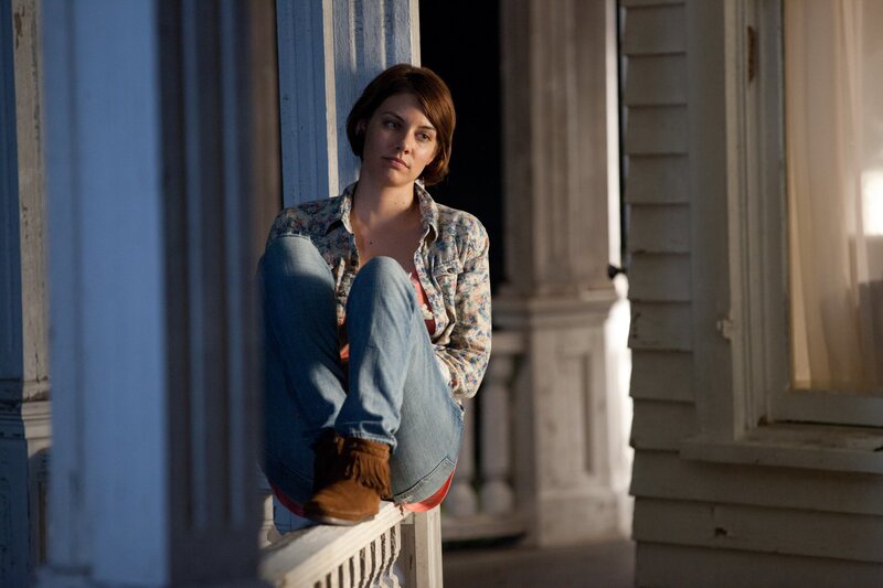 woman sitting on porch