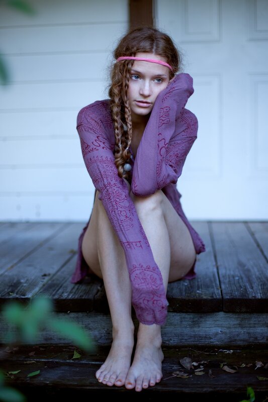 woman sitting on porch