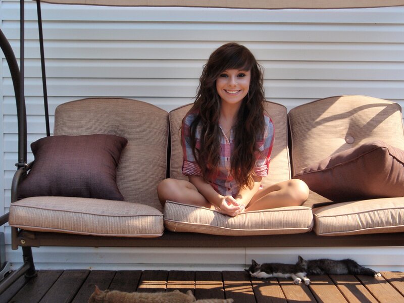 Woman sitting on porch swing
