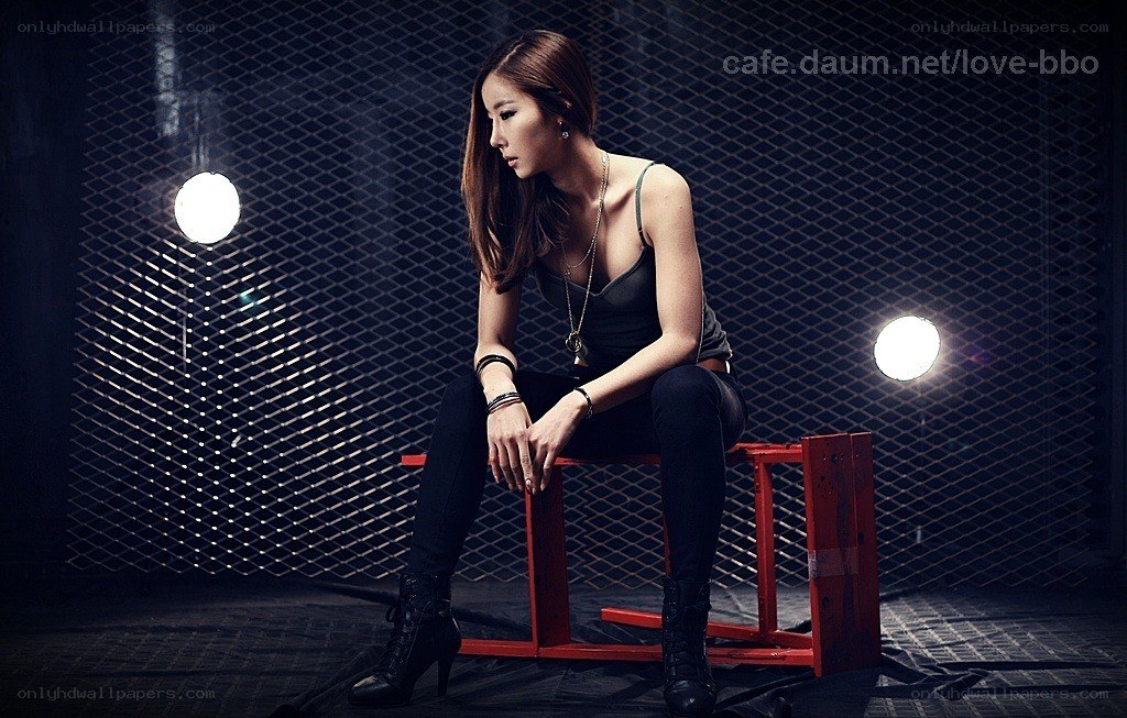 woman sitting on red bench
