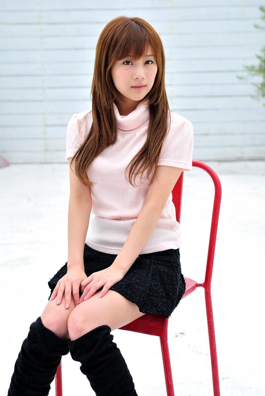 woman sitting on red chair
