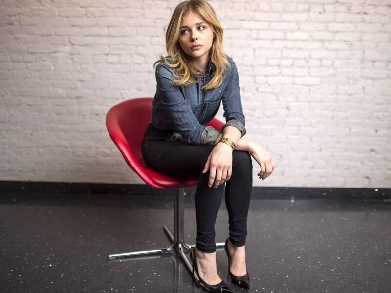 Woman Sitting on Red Chair — Neutral