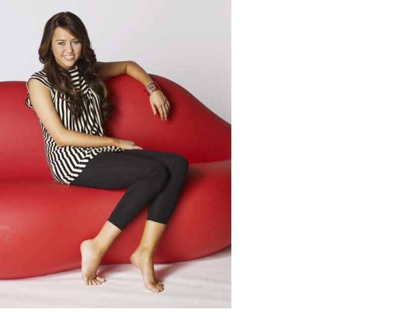 woman sitting on red couch
