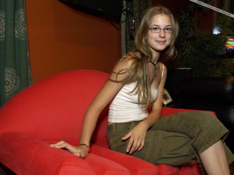 woman sitting on red couch