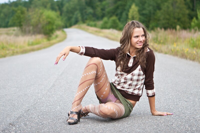 woman sitting on road