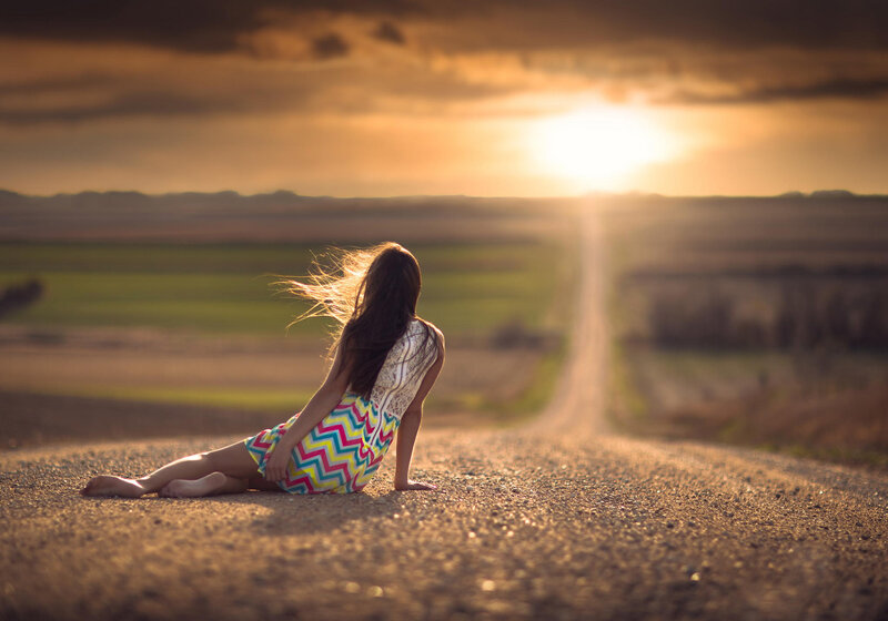 Woman Sitting on Road — Gold