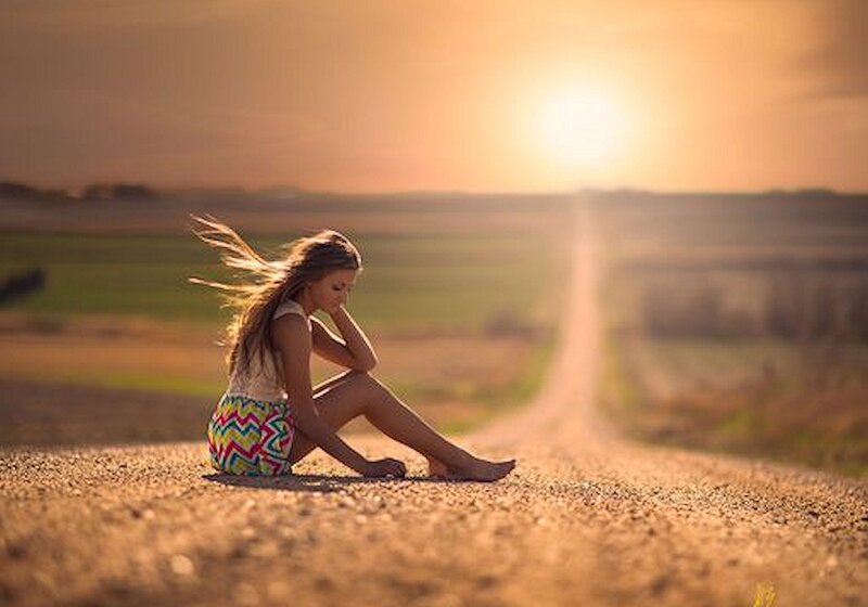 Woman Sitting on Road — Golden