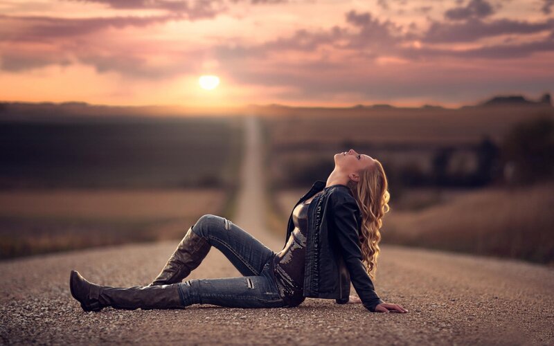 Woman Sitting on Road — Orange