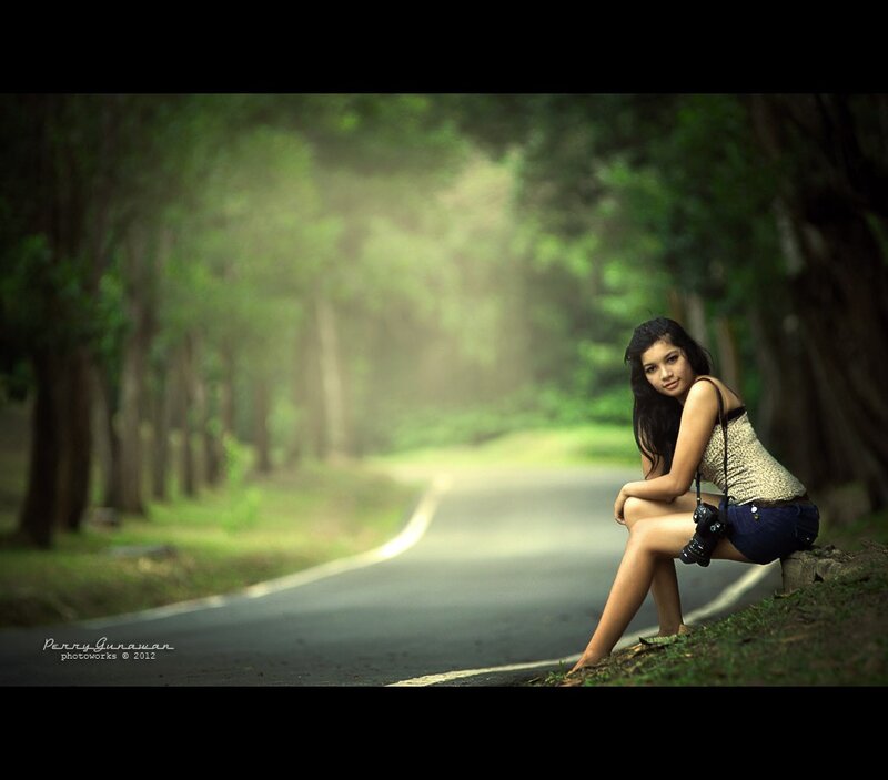 woman sitting on roadside
