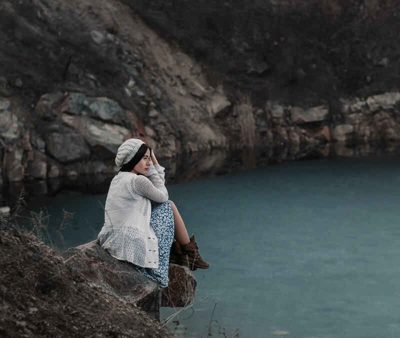 Woman Sitting on Rock — Blue, Contemplative