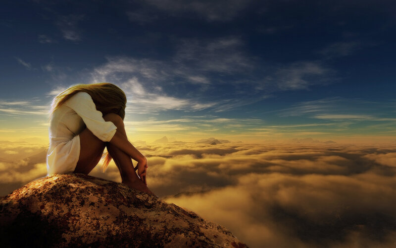 Woman Sitting on Rock — Blue