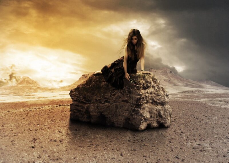 Woman Sitting on Rock — Brown, Dramatic, Sunset