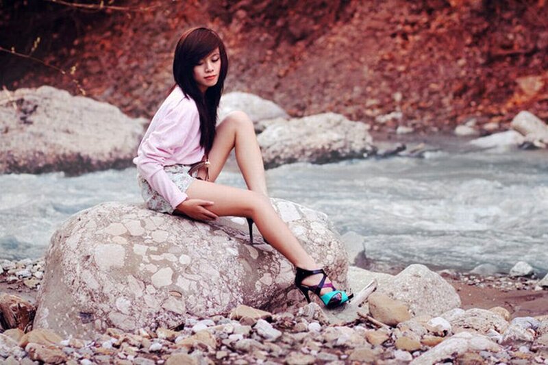 Woman Sitting on Rock — Pink
