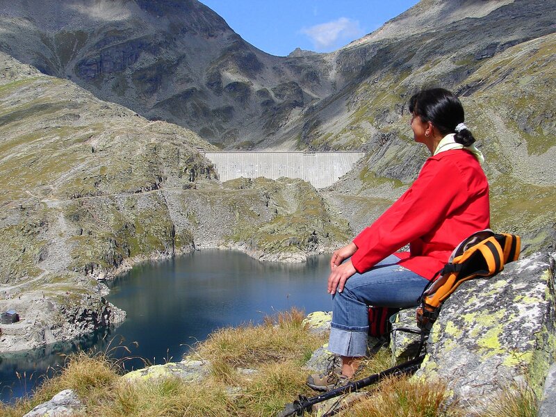 Woman Sitting on Rock — Red, Serene