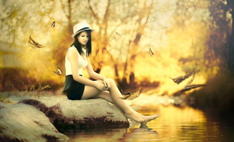 Woman Sitting on Rock — Yellow, Serene